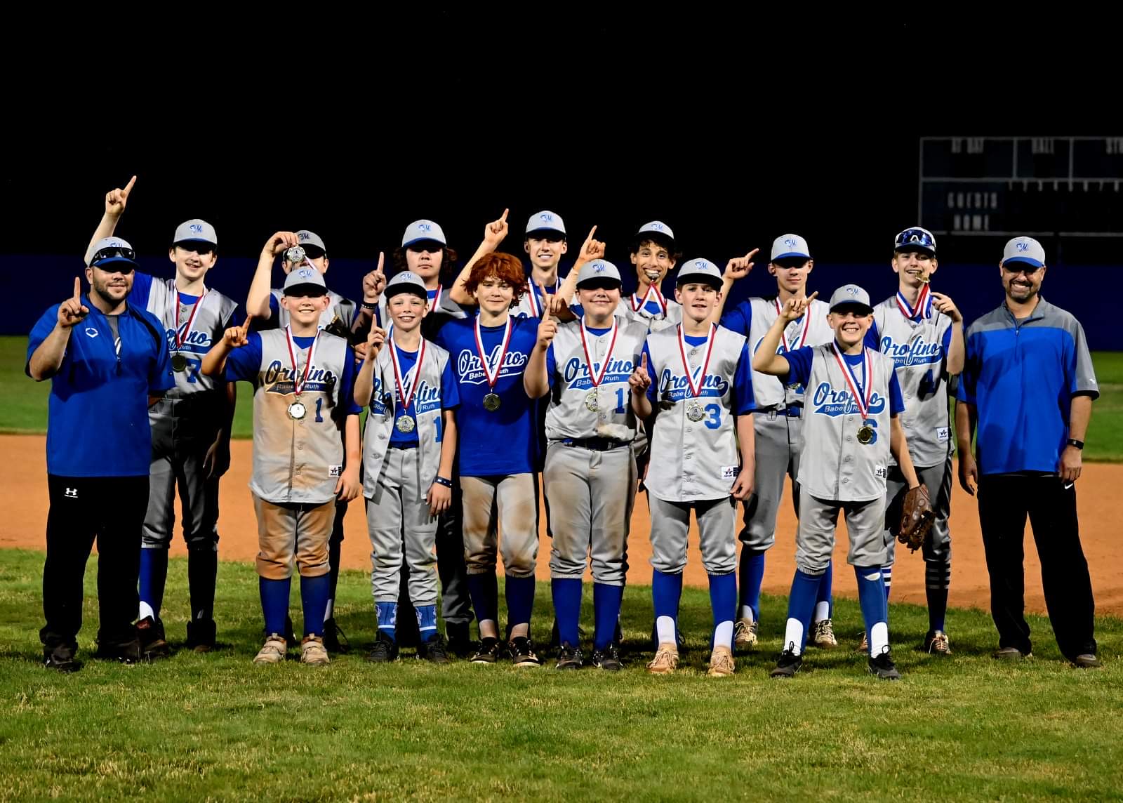 Orofino baseball team celebrating a championship on the field