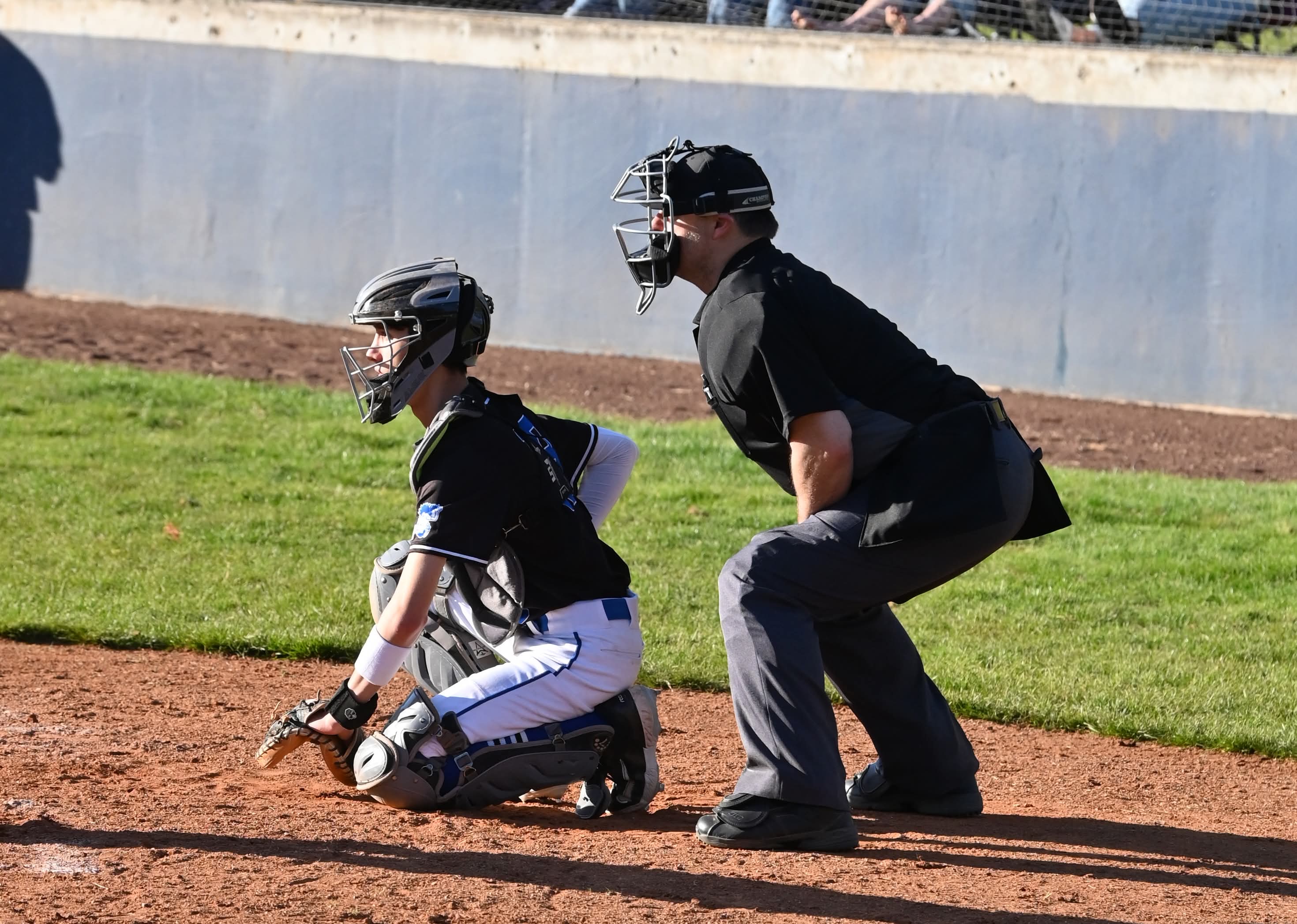 Christopher Merry working behind the catcher during a baseball game